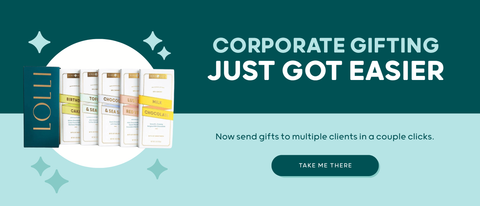 Promotional banner for Lollipar products with the headline 'CORPORATE GIFTING JUST GOT EASIER' on a dark teal background, showing several Lollipar gift boxes and tubes, plus a light aqua lower section with descriptive text and a 'TAKE ME THERE' button.