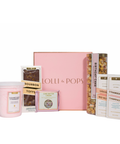Lolli & Pops dessert gift set with cotton candy, caramel corn, and chocolate bars and boxes on a white background