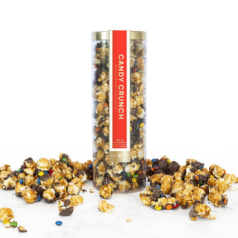 Candy Crunch popcorn in a clear cylindrical container with a red label on a white background