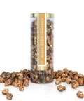 Caramel cold brew popcorn in a cylindrical container on a white background