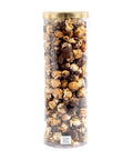 Cylindrical container filled with assorted popcorn flavors on a white background