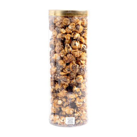 Tall cylindrical container filled with popcorn on a white background
