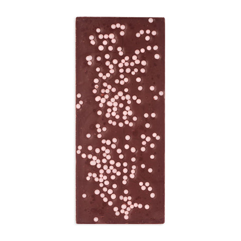 Chocolate bar with white chocolate chips on a white background