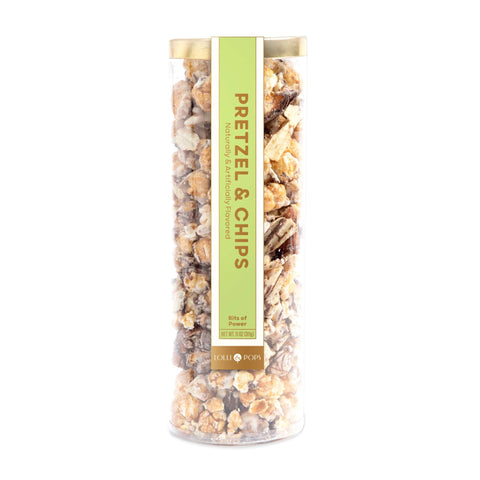 Glass jar filled with pretzels and chips on a white background