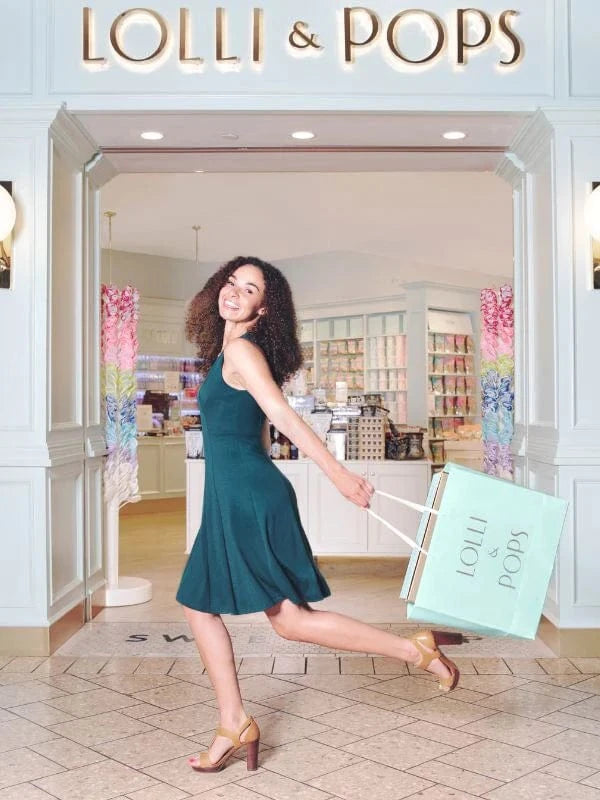 Lolli and Pops shopper in front of store