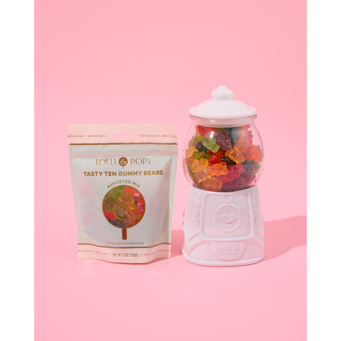 tasty ten gummy bears on pink background. styled in gum ball machine